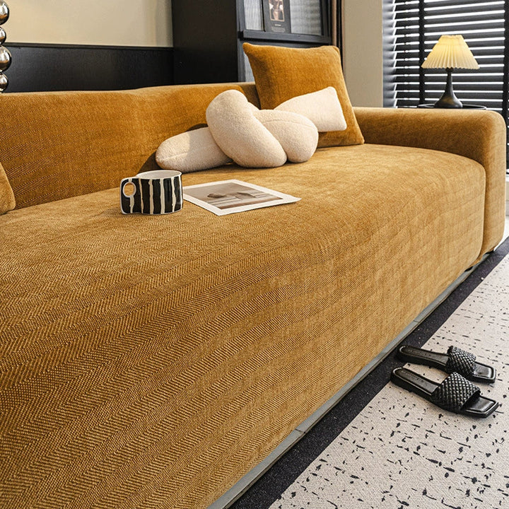 Elasticized pet protection sofa cover in elegant herringbone chenille for a snug fit