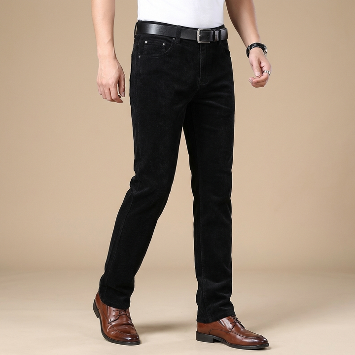 Detail of the button closure on men's premium corduroy dress trousers, designed for comfort.