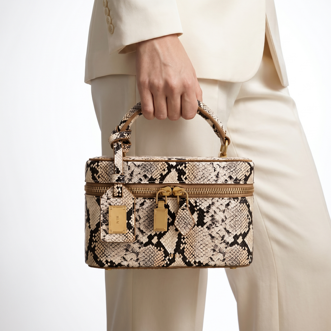 White faux leather crocodile embossed box bag. Elegant structured women's handbag with shoulder strap. Fashion accessory.