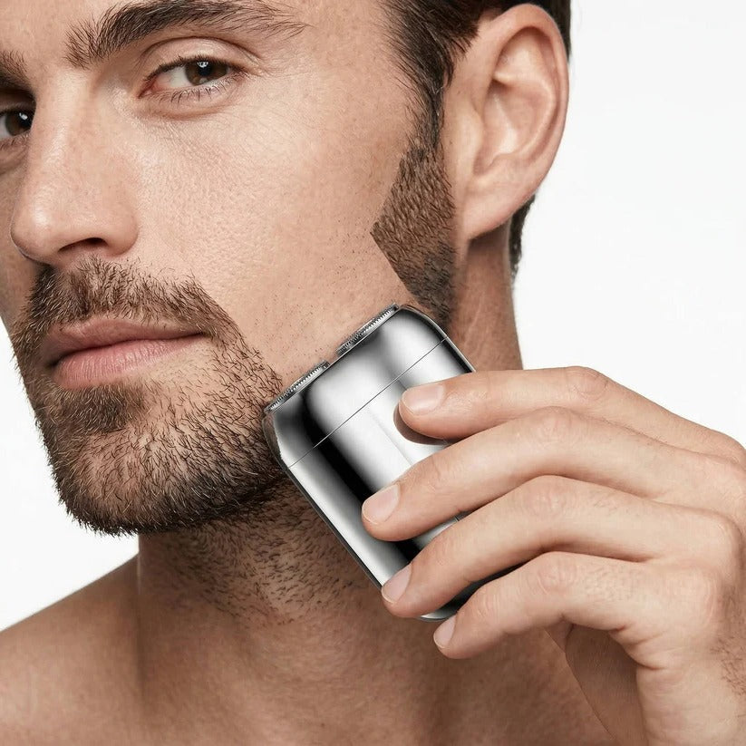 Waterproof men's electric shaver with magnetic head. Rechargeable & portable for quick wet/dry shaving.