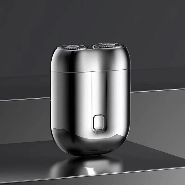 Men's portable electric shaver with magnetic head for fast, quiet wet/dry shave. Rechargeable travel razor.