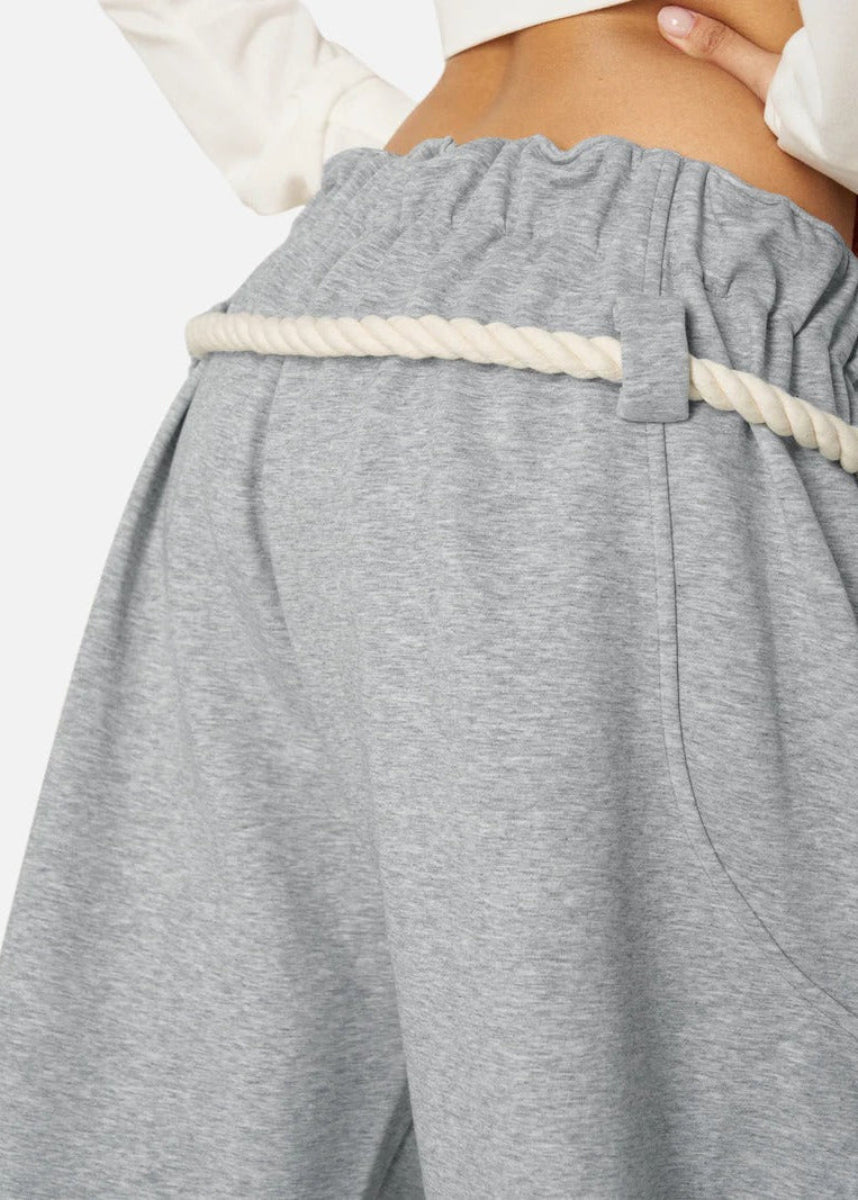 Solid color women's barrel leg sweatpants with a high waist and comfortable oversized fit for everyday wear.