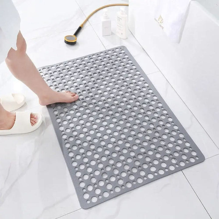 Stylish rectangular anti-slip shower mat enhances home decor & bathroom safety. Hygienic, durable PVC.