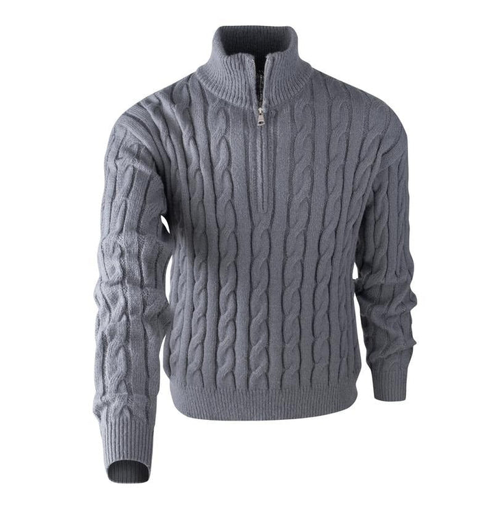 Full view of a man wearing a stylish cable knit quarter-zip sweater, showcasing its structured fit and casual wear appeal.