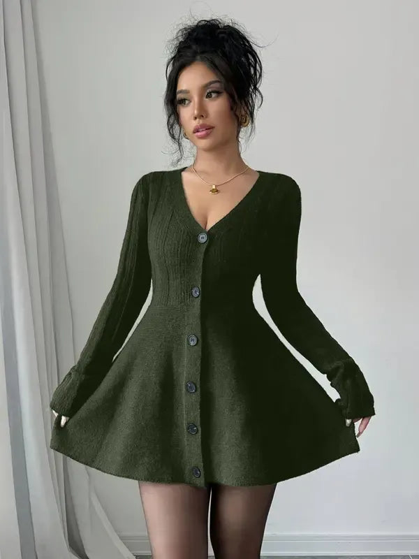 Women's green V-neck flared mini dress, long sleeve. Flattering elegant style for fashion-forward women.