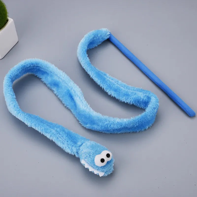 Close-up of a plush pink worm attached to an interactive cat wand toy for kitten play