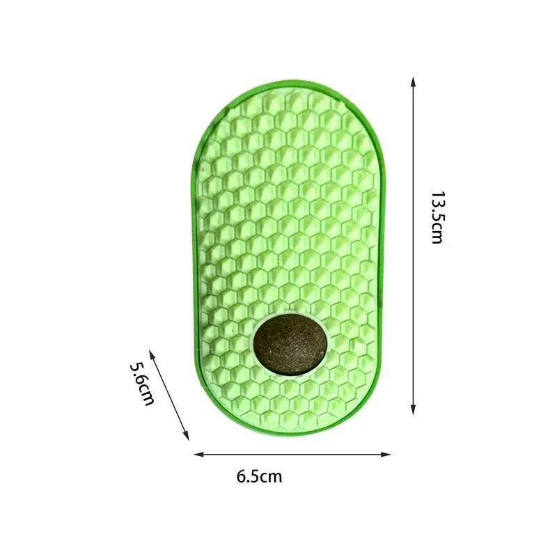 Ergonomic interactive catnip grooming brush designed for effective shedding and feline comfort