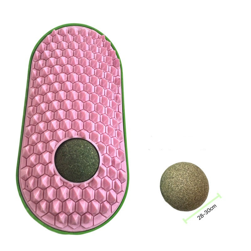 A happy cat rubbing against an interactive catnip grooming brush, a great grooming comb & toy