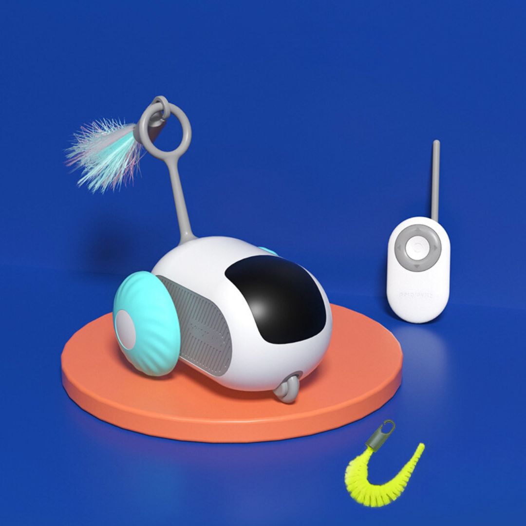 Two cats observing an interactive remote control cat toy in motion, encouraging feline play.