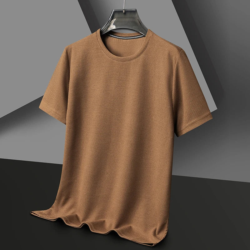Stylish men's waffle knit t-shirt in a relaxed fit, perfect for versatile everyday casual wear.