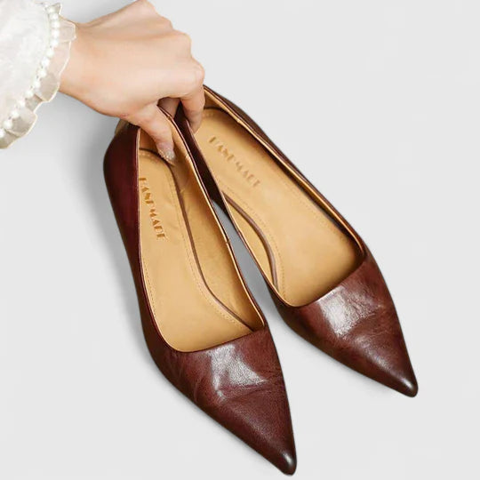 Elegant women's black pointed toe kitten heel dress shoes, perfect for work or evening wear. Slip-on design.