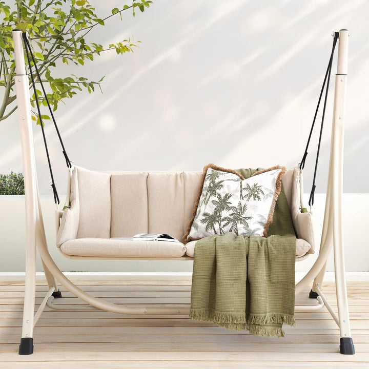 Beige 2-seater outdoor patio swing bench with canopy, perfect for garden or backyard relaxation.