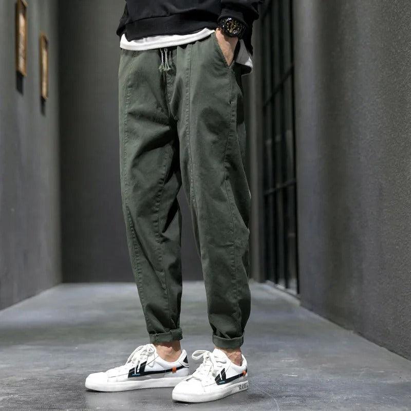 Comfortable men's green tapered joggers, ideal for activewear or relaxed everyday fashion.