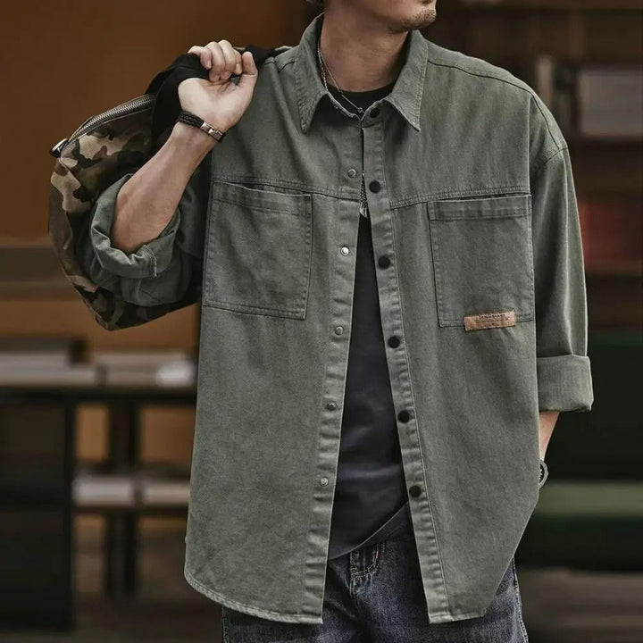 Cotton blend men's casual button-up shirt with vintage style, featuring snap front and long sleeves.