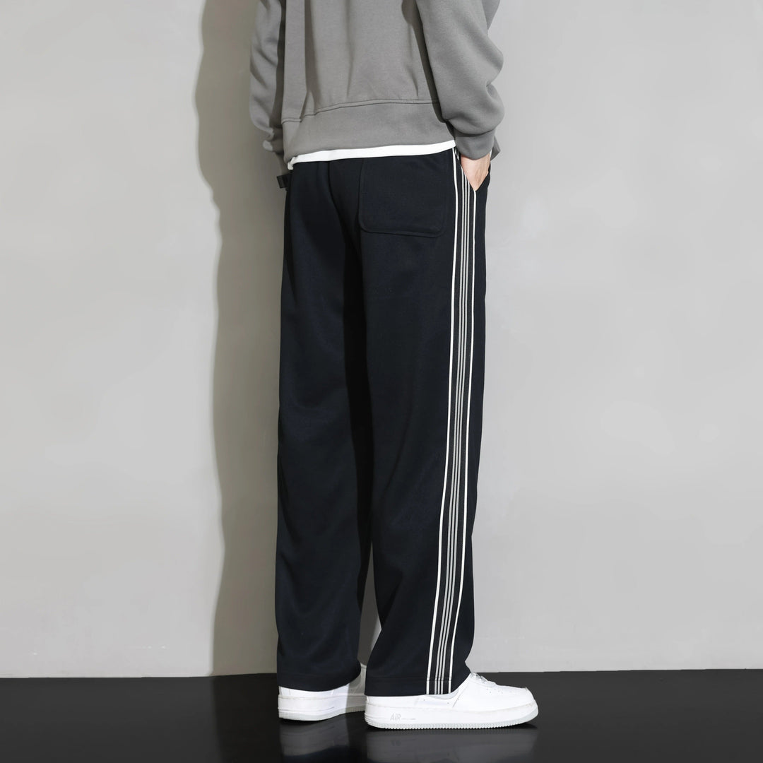 Relaxed fit men's stripe joggers. Casual polyester leisurewear with comfortable drawstring.