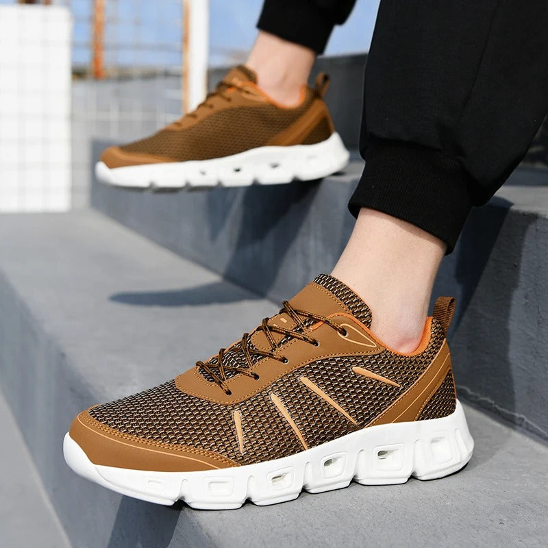 Side profile of blue unisex running shoes, highlighting lightweight construction, supportive sole, and ultimate comfort.