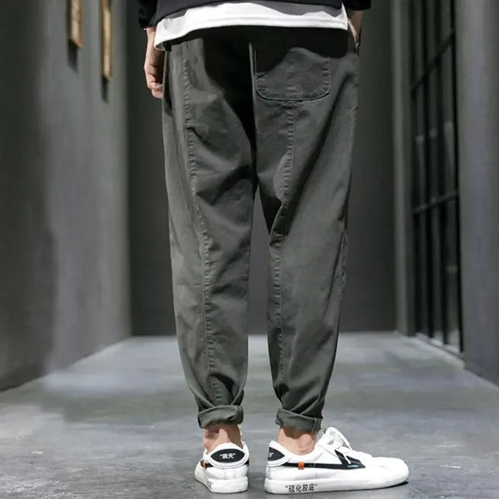 Men's green tapered drawstring joggers, combining comfortable activewear with sleek casual fashion.