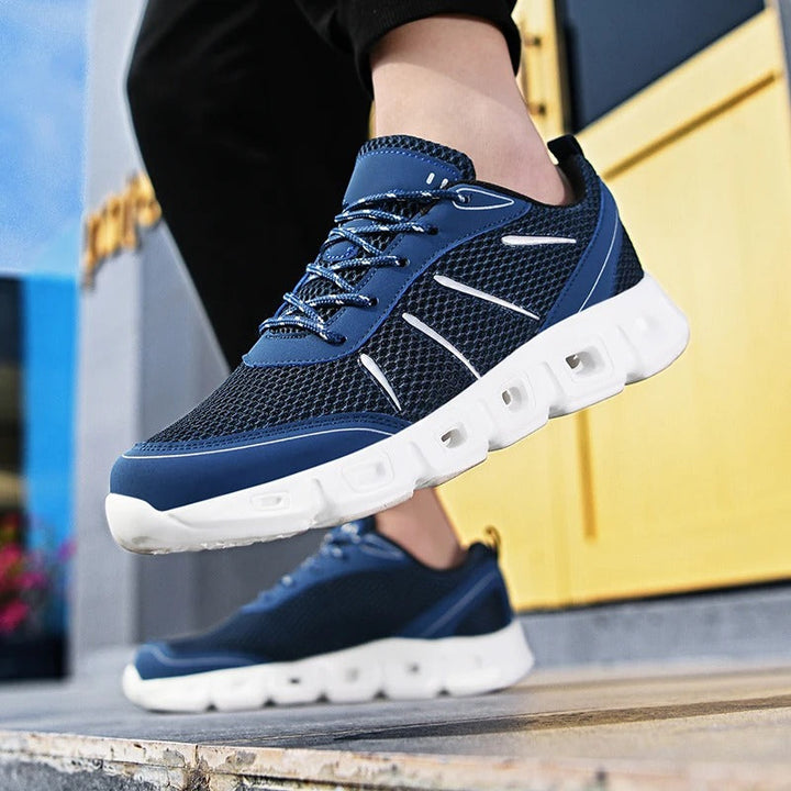 High-performance blue unisex running shoes, offering lightweight comfort, excellent breathability, and reliable support.