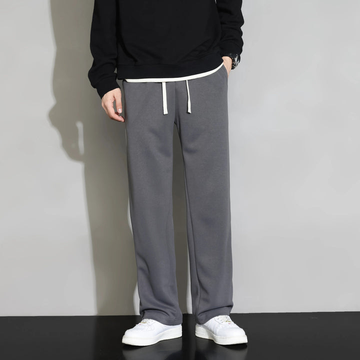 Stylish men's relaxed fit joggers featuring a leisure stripe pattern, ideal for daily comfort.