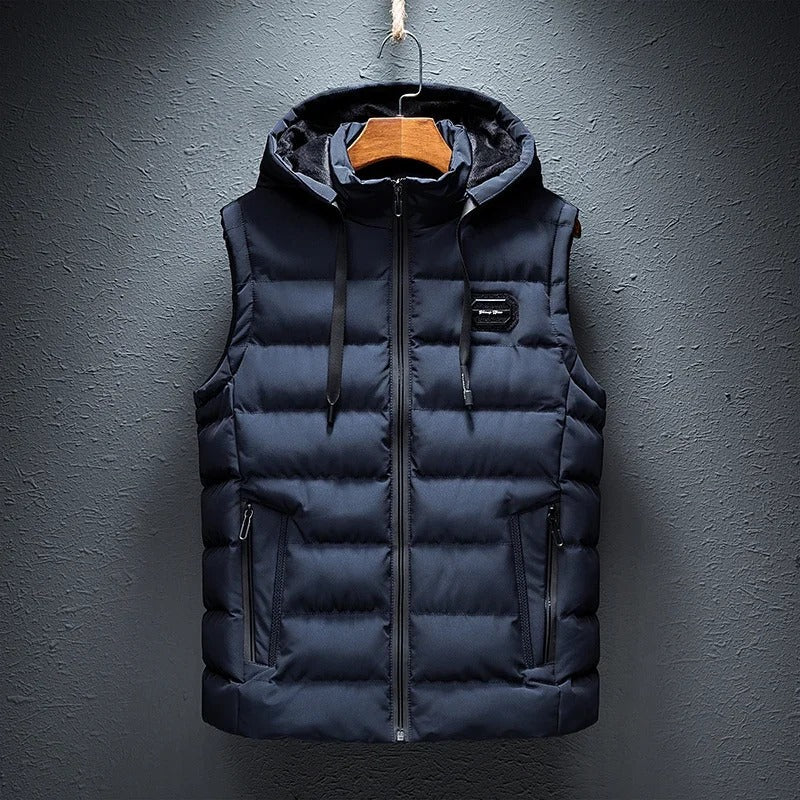 Stylish men's insulated alpine vest, durable outerwear with detachable hood, perfect for winter adventures.