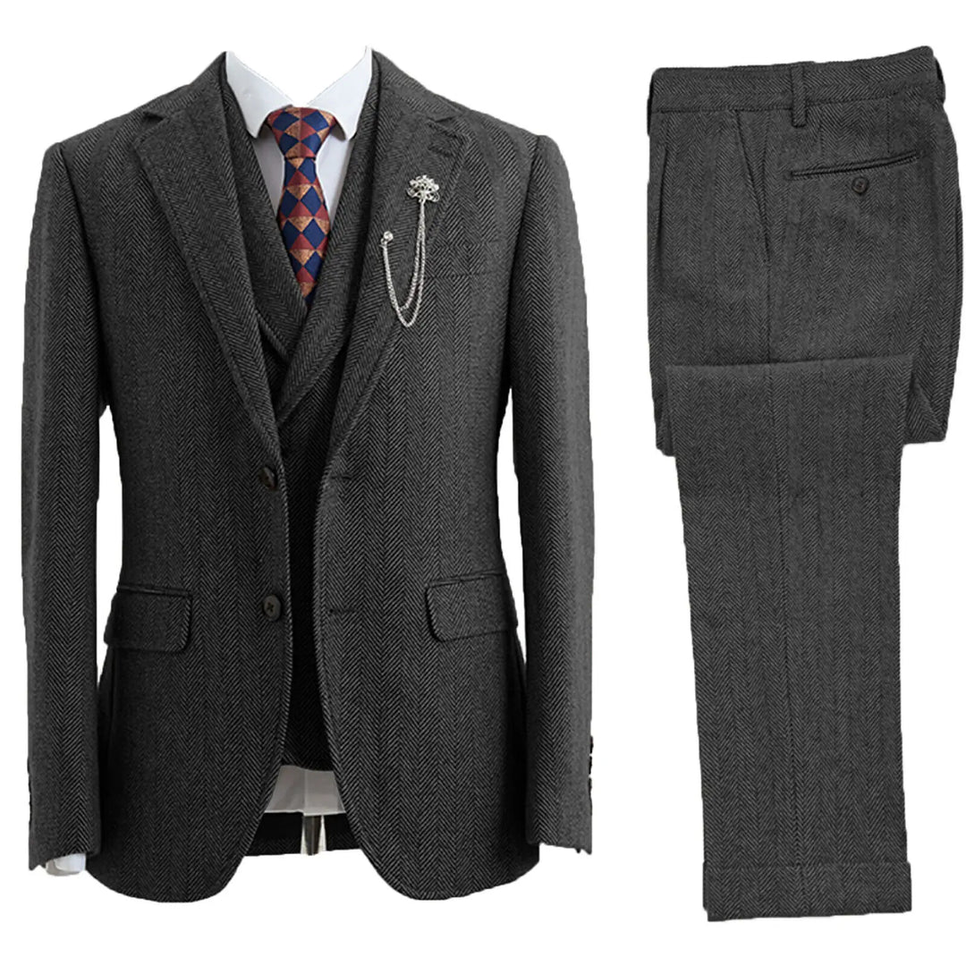 Tailored men's 3-piece suit with herringbone pattern jacket, vest & trousers. Ideal for weddings & parties.