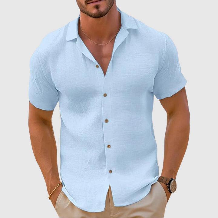 Versatile men's linen button-down shirt. Relaxed long-sleeve style for comfortable casual summer and beach days.