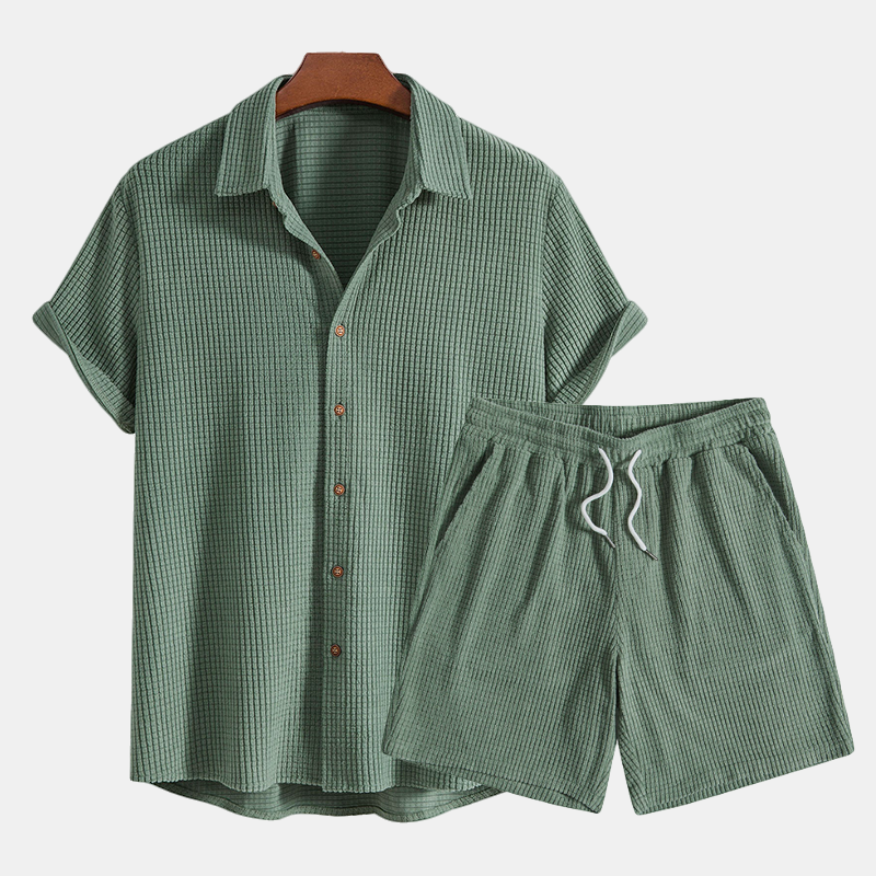 Stylish men's two-piece summer outfit featuring a comfortable short sleeve shirt.
