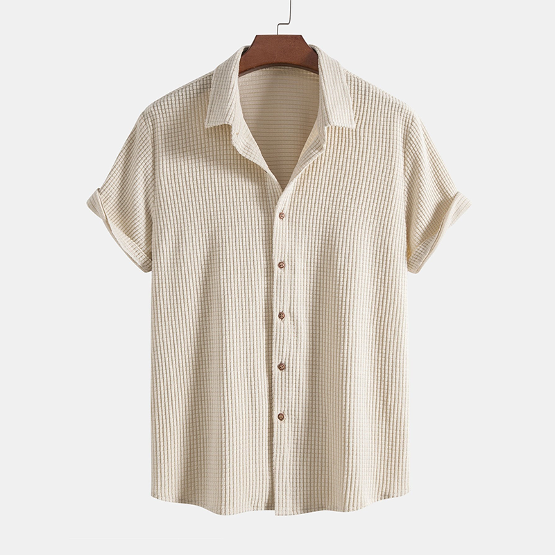 Men's relaxed fit textured short sleeve shirt paired with casual drawstring shorts.