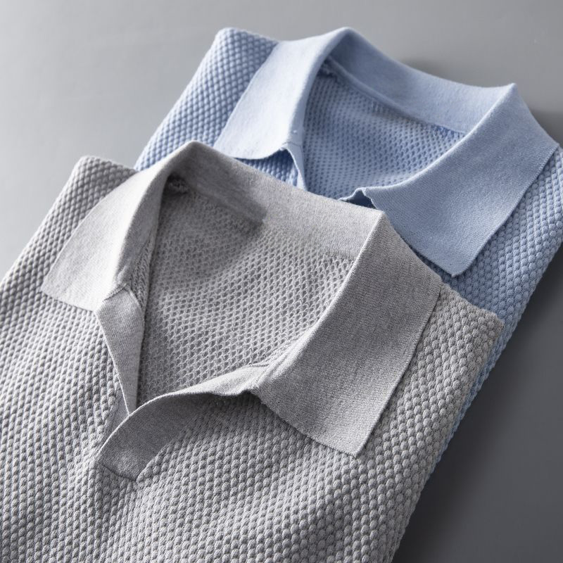 Men's classic short sleeve polo with a subtle textured geometric pattern, great for everyday casual style.