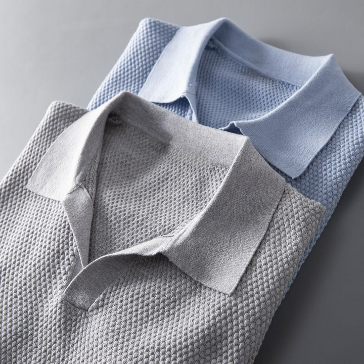 Men's classic short sleeve polo with a subtle textured geometric pattern, great for everyday casual style.