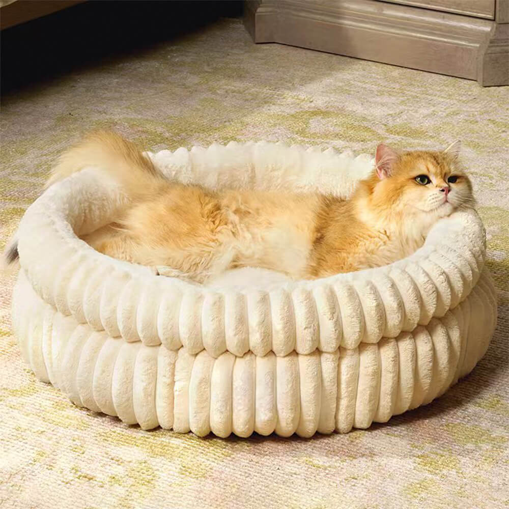 Creamy beige minimalist pet bed, a cozy haven for anxiety relief in dogs and cats