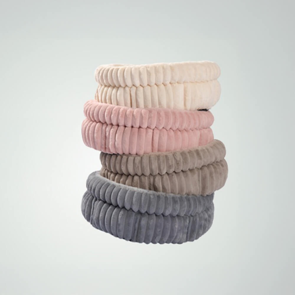 Modern minimalist pet bed in a neutral tone, providing warmth and anxiety relief for pets