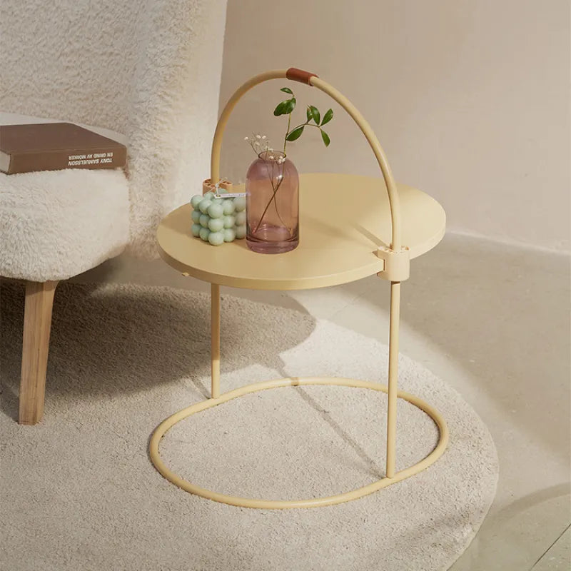 Stylish cat scratching tower with natural sisal surface and an attached pom-pom toy for interactive feline fun