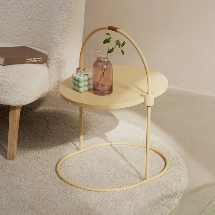 Stylish cat scratching tower with natural sisal surface and an attached pom-pom toy for interactive feline fun