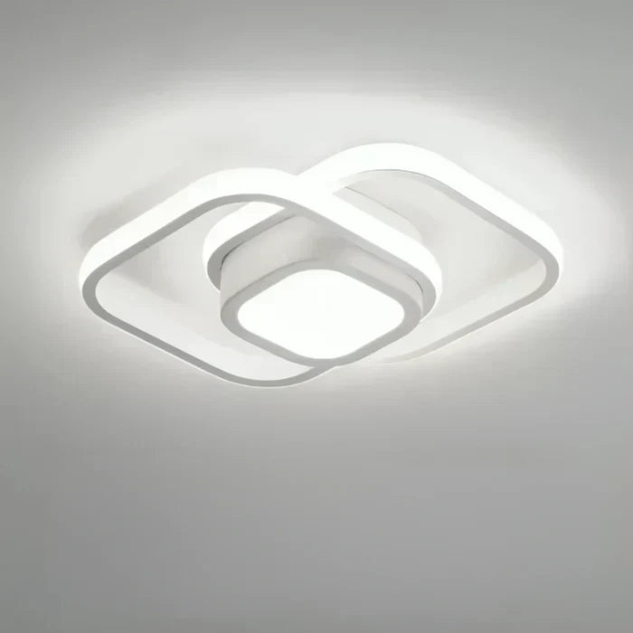 White dual ring LED ceiling lamp. Modern, sleek design with energy-efficient light for home & contemporary spaces.