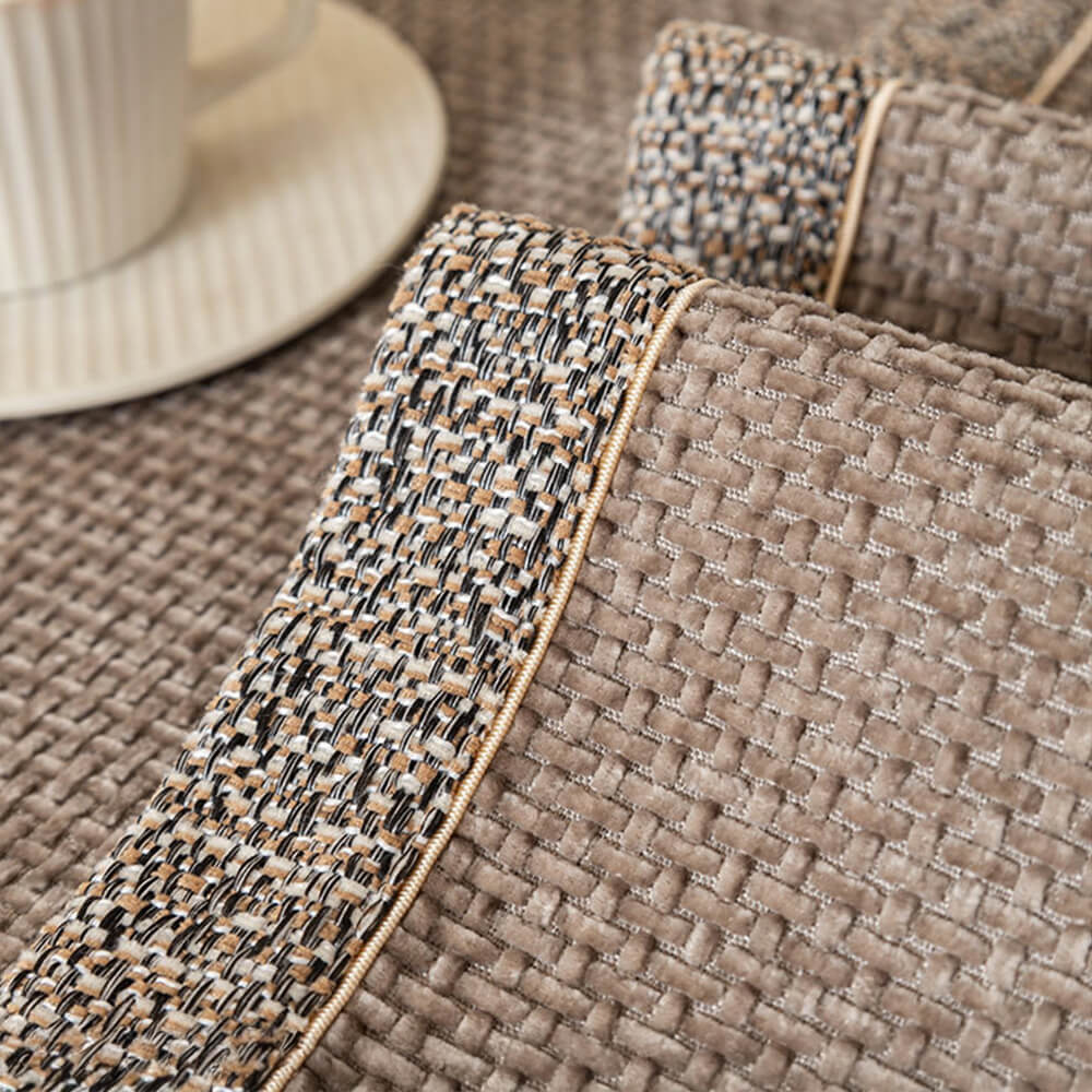 Anti-slip backing detail of a modern chenille tweed couch cover, ensuring stability