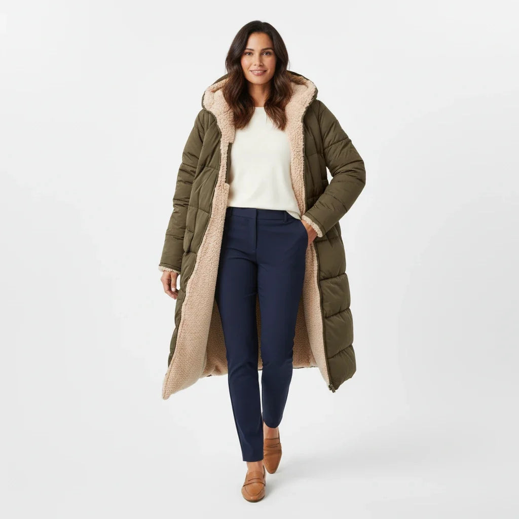 Insulated women's hooded winter jacket, oversized and warm for comfort.