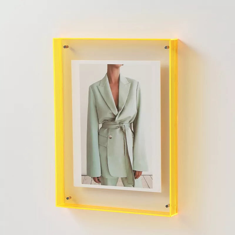 Elegant acrylic photo frame, a vibrant piece for wall decor or charming table display.