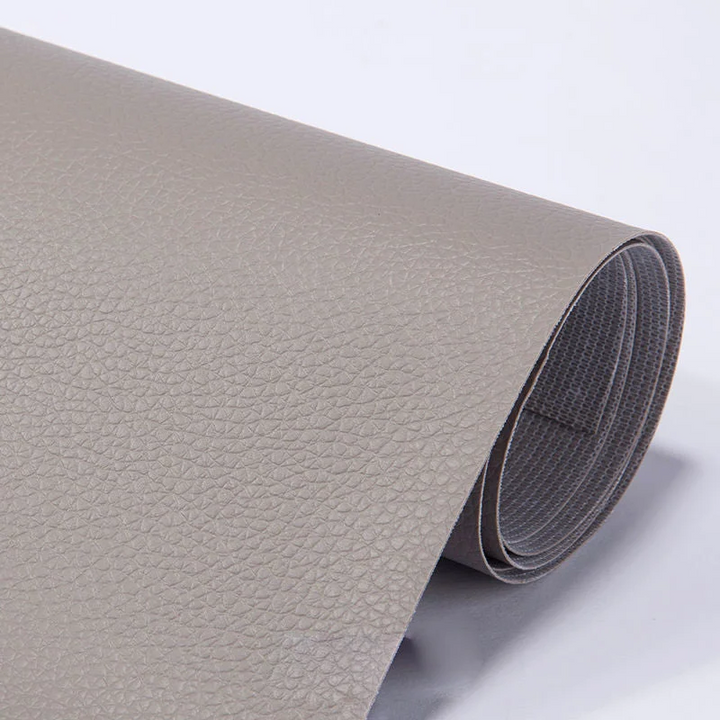 Durable PU leather repair patch (50x137cm) with strong self-adhesive for upholstery & car seat fixes.