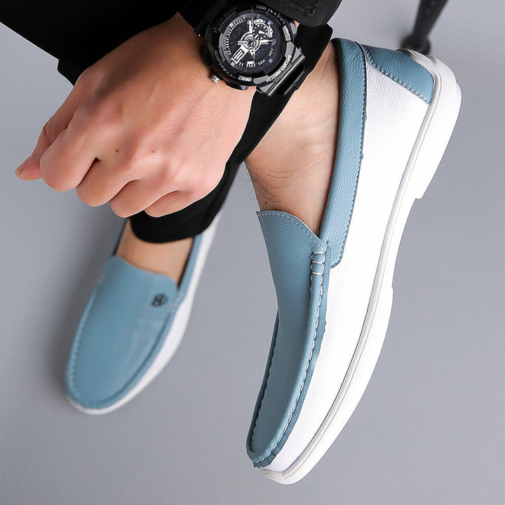 Contemporary men's two-tone loafers, offering slip-on convenience and sophisticated charm.