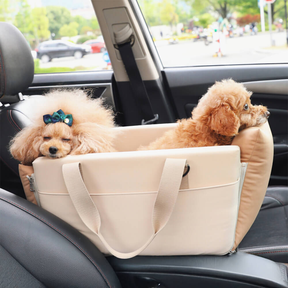 Pet car console travel carrier with safety leash for small dogs and cats, waterproof fabric.