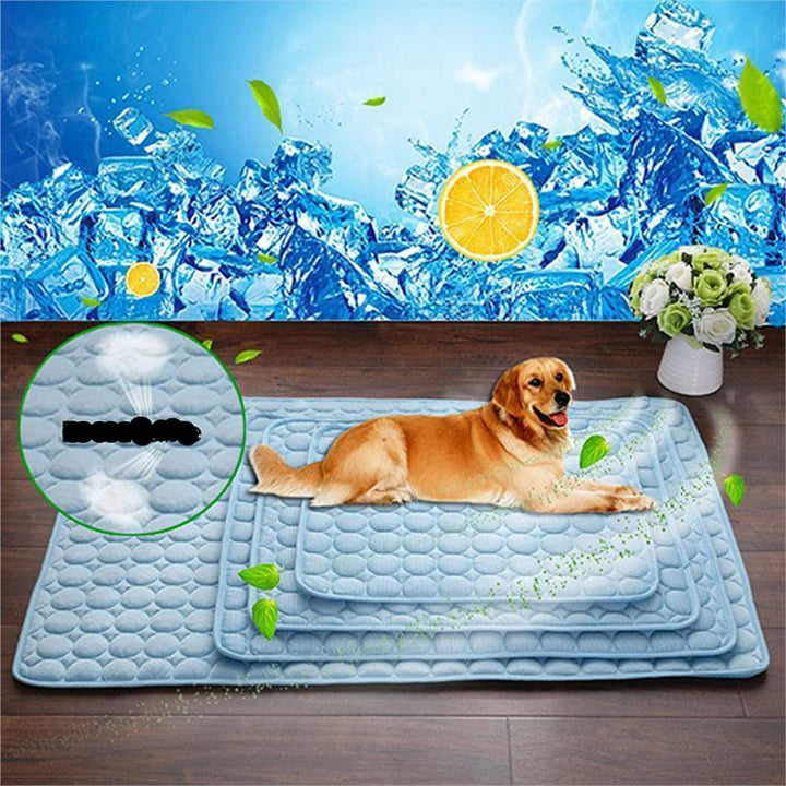 Dog relaxing on Pet Cooling Mat, light blue ice silk mat for summer pet comfort and cooling