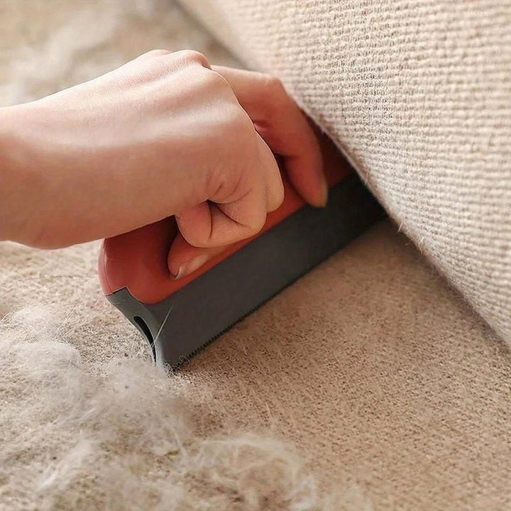 Dog being gently groomed with a pet deshedding brush, showing before and after hair removal