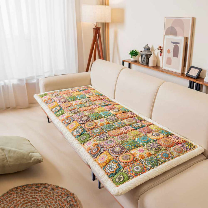 Sofa protector in light gray, pet friendly, non-slip, cotton, covering a three-seater couch