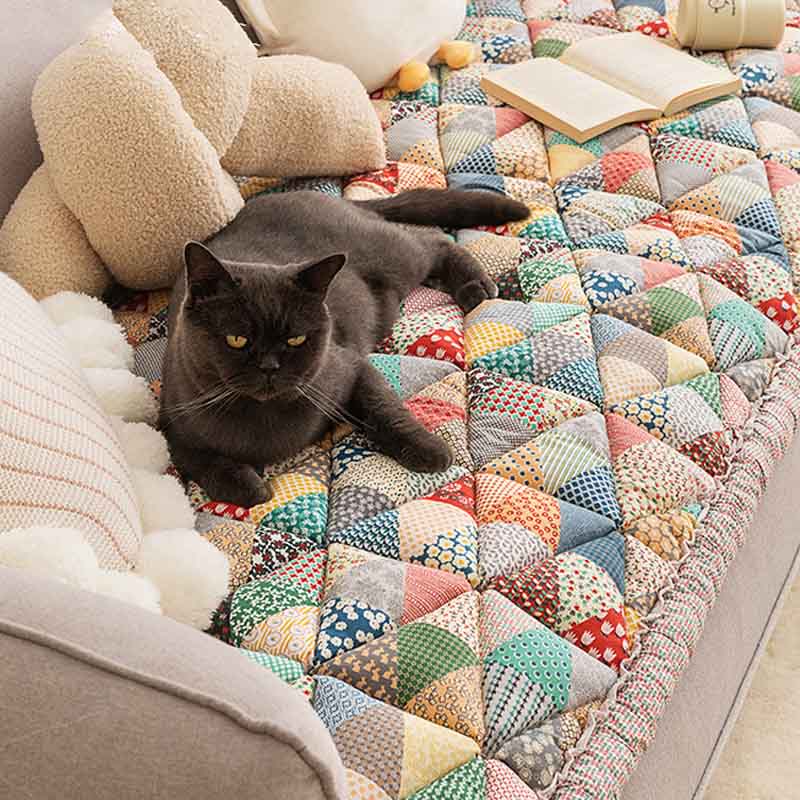 Quilted cotton pet sofa protector in blue, protecting furniture from scratches and spills