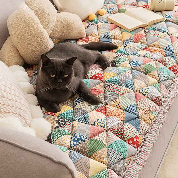 Quilted cotton pet sofa protector in blue, protecting furniture from scratches and spills