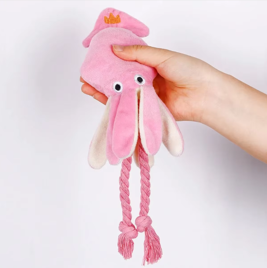 Pink squid plush dog toy, durable for pet interactive chew time