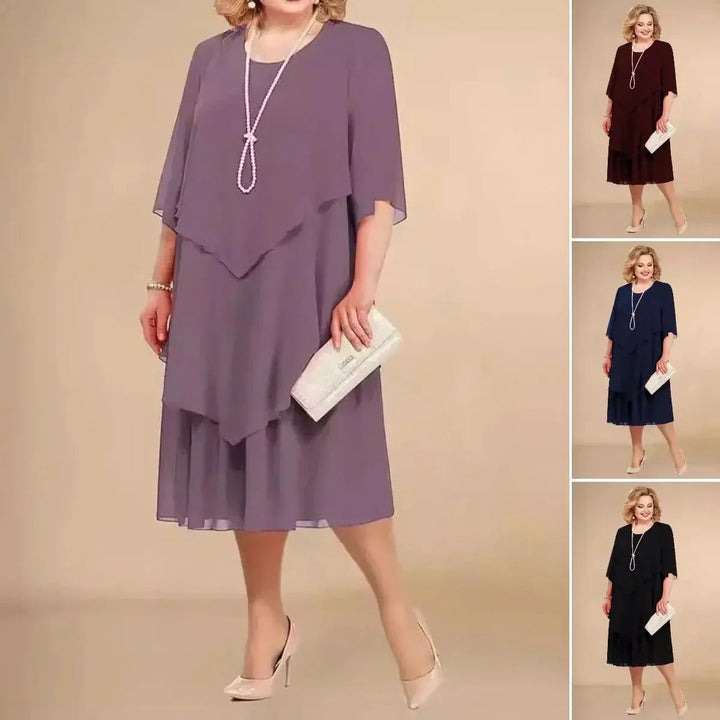 Versatile plus size purple chiffon dress, perfect for evening wear or special occasions, with elegant layers & 3/4 sleeves.