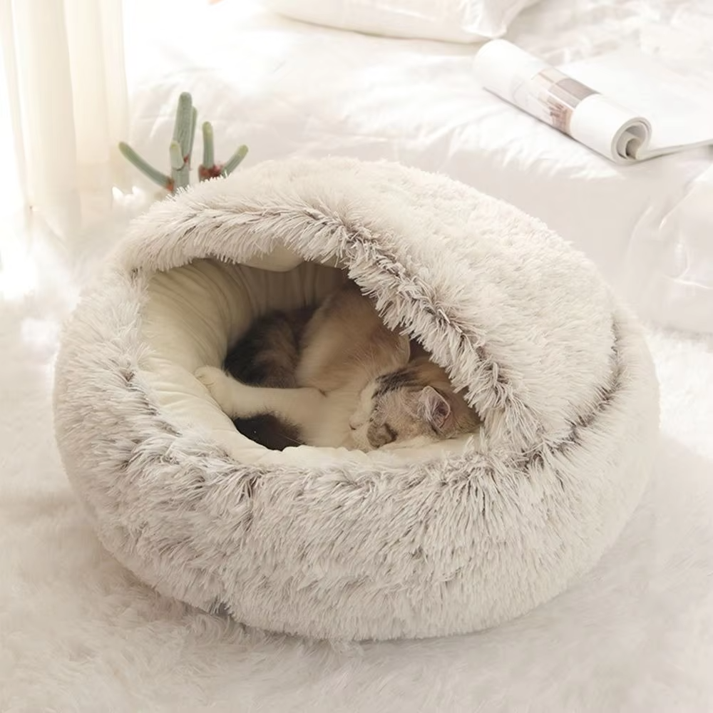 Plush 2-in-1 cat bed and cave in a cozy, soft gray material, ideal for pet comfort and sleep.