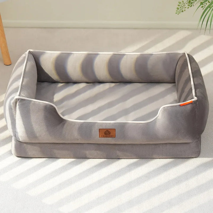 Plush dog sofa bed with soft bolster, orthopedic support, and removable cushions for easy cleaning